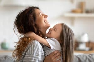 mom daughter laughing