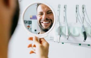 man looking in mirror